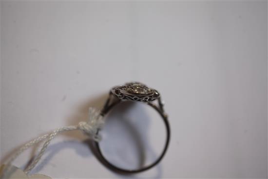 An attractive early 20th century French platinum and diamond cluster upfinger dress ring, size Q.